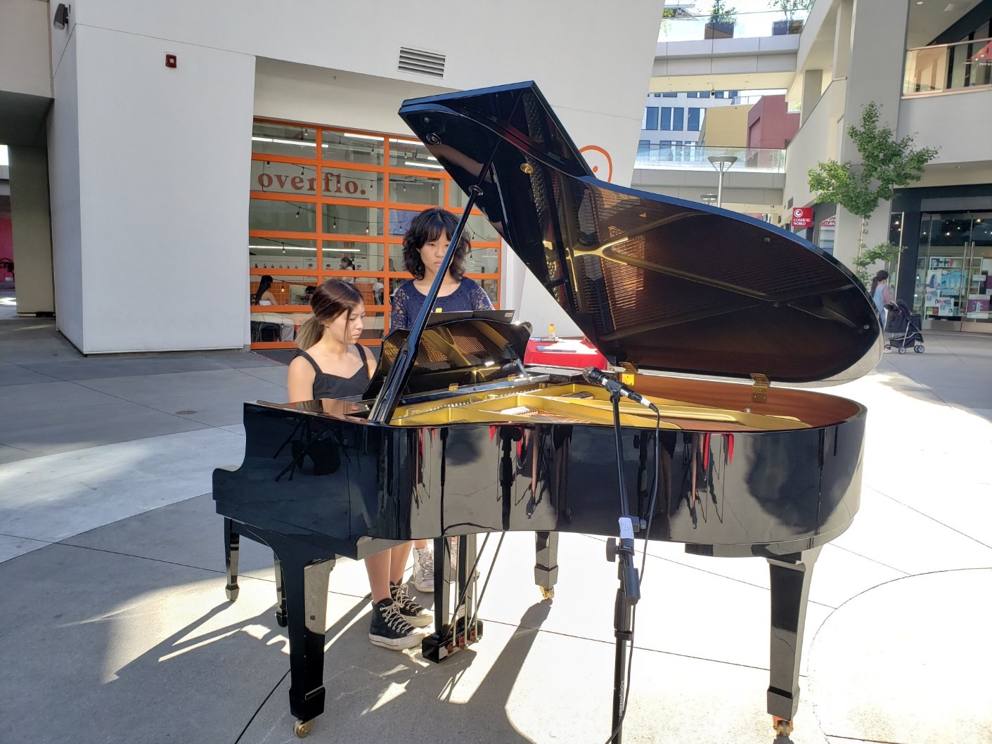 Ellen Hwang performing piano in the community