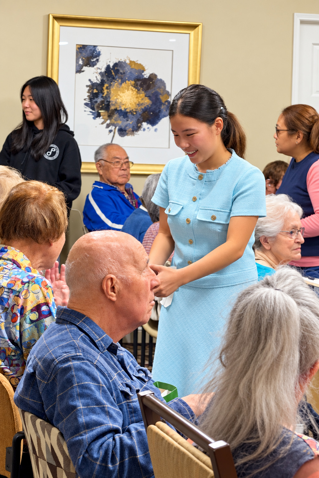 Ellen Hwang in a light blue dress greeting senior residents at a community event